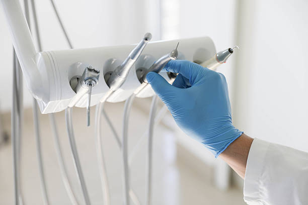 Professional Tooth Extraction technician working in DeSoto County County, MS